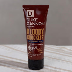 Close-up of Duke Cannon label and ingredients, illustrating lanolin-based repair benefit