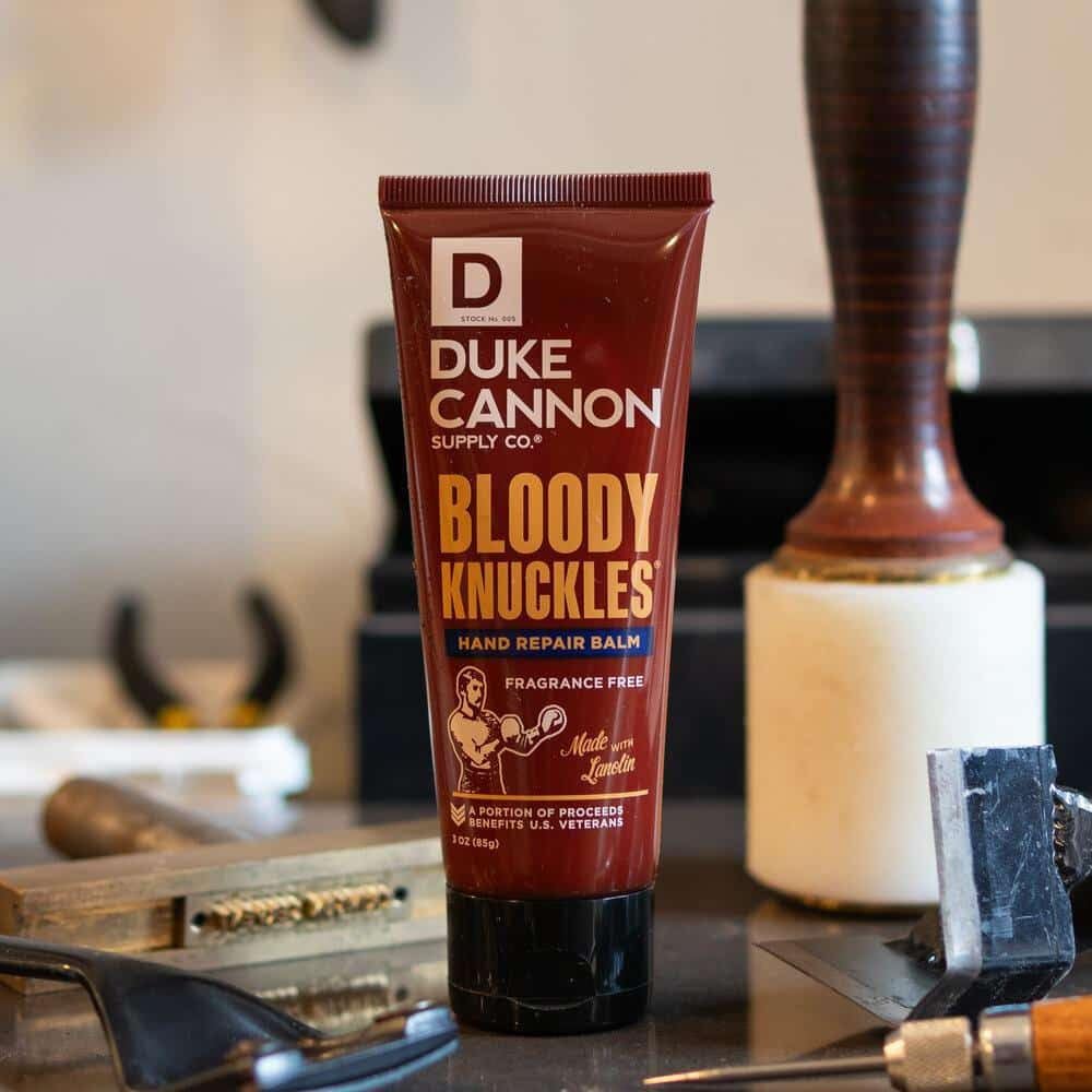 Duke Cannon tube with balm visible and smooth texture, demonstrating fast-absorbing hydration benefit