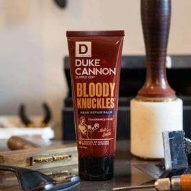 Duke Cannon tube with balm visible and smooth texture, demonstrating fast-absorbing hydration benefit