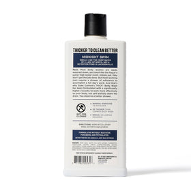 Duke Cannon Bourbon bottle next to towel conveying warm scent and daily comfort