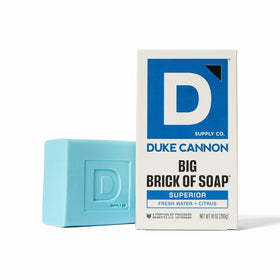Duke Cannon citrus bar foam in hand illustrating bright cleansing and refreshing benefit.