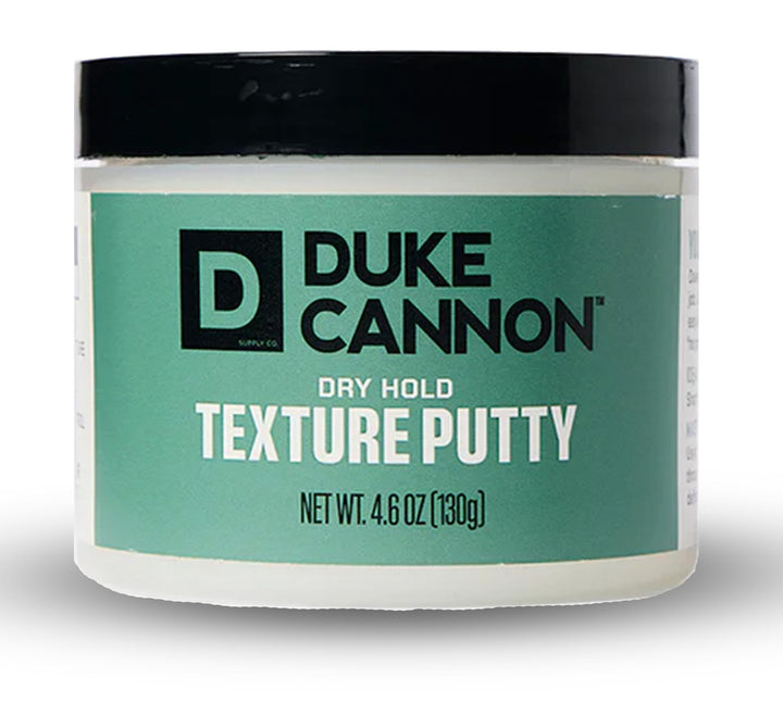 Duke Cannon front tin view showing compact, travel-ready packaging and clear product identity