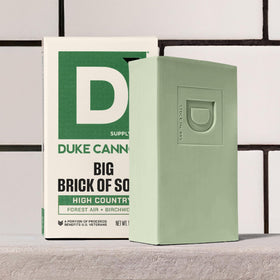 Duke Cannon High Country with woods background suggesting birchwood scent
