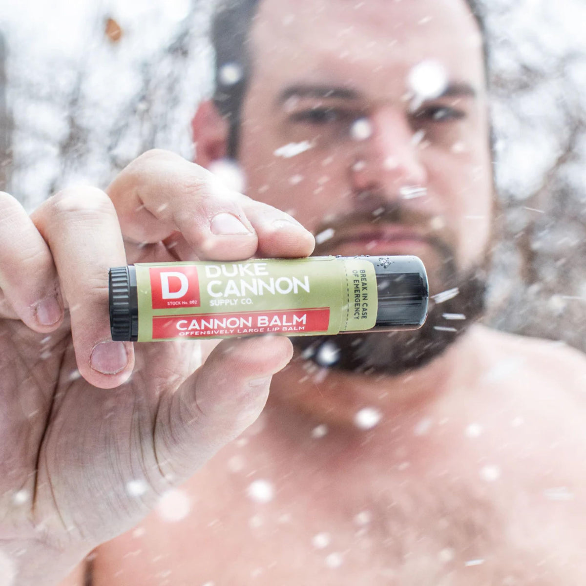 Duke Cannon lifestyle hiker using balm outdoors for sun protection and comfort
