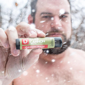 Duke Cannon lifestyle hiker using balm outdoors for sun protection and comfort