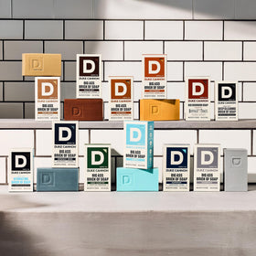 Three-pack of Duke Cannon Midway bars staged to show quantity and gift-ready presentation