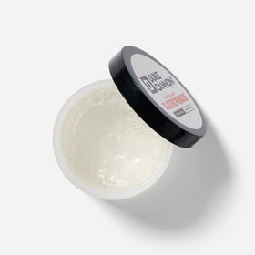 Duke Cannon open jar close-up revealing pomade texture and smooth application benefit
