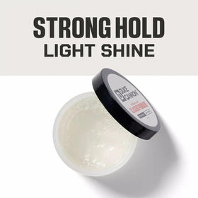 Applying Duke Cannon pomade in hand for natural texture and volume