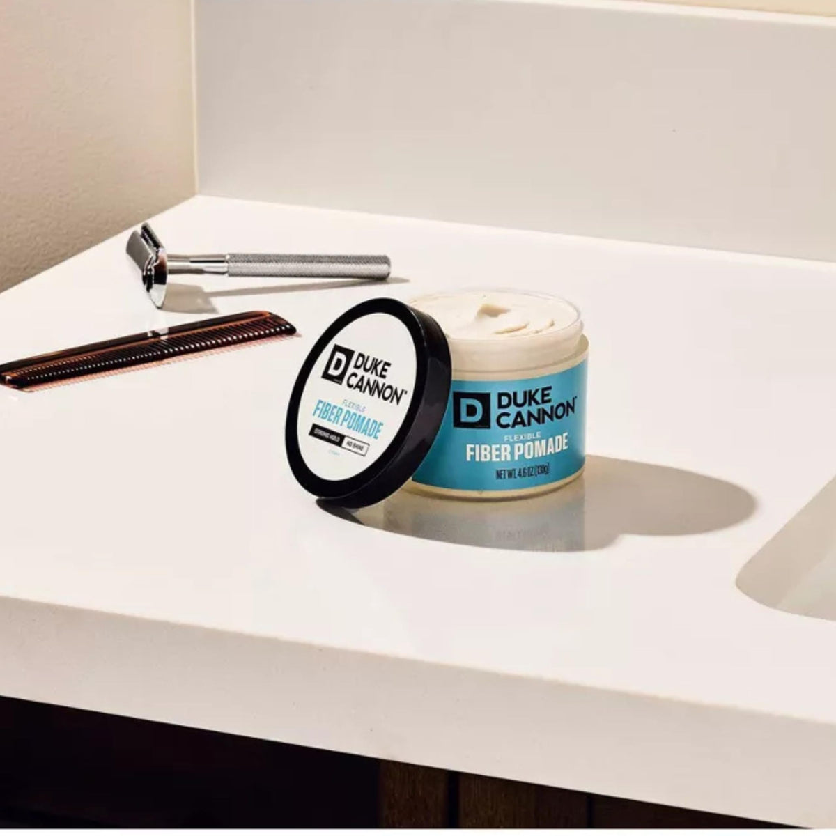 Duke Cannon pomade beside ruler showing 4.6 oz practical size