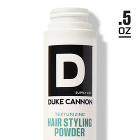 Powder placed inside a travel kit, Duke Cannon conveying convenient on-the-go styling