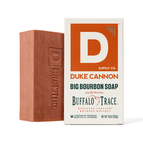 Duke Cannon hand holding bar for scale showing 10 oz size and extended use benefit