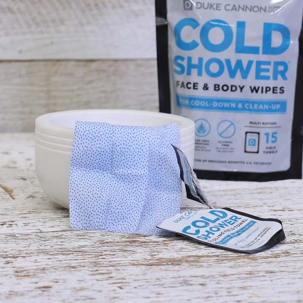 Duke Cannon towel held in hand to show size and portability for on-the-go convenience