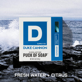 Close-up of a Duke Cannon soap puck texture highlighting exfoliating surface and rich lather