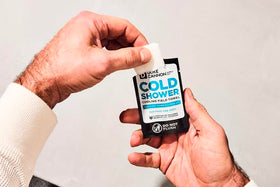 Duke Cannon towel in hand showing size and one-handed use convenience