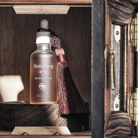 DumiDang serum texture on skin close-up, shows quick absorption and smooth finish
