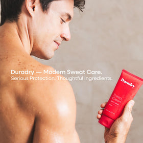 Duradry bottle next to passport for travel-friendly size comparison