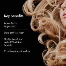 Label close-up on Dyson bottle highlighting chitosan, argan and grapeseed oil ingredients