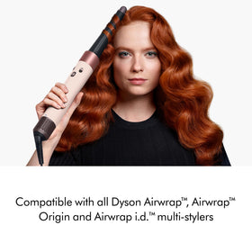 Dyson conical barrel in use creating curls with visible root lift