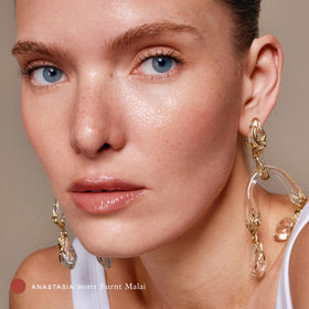 EADEM gloss finish on model lips displaying Burnt Malai sheen and non-sticky shine