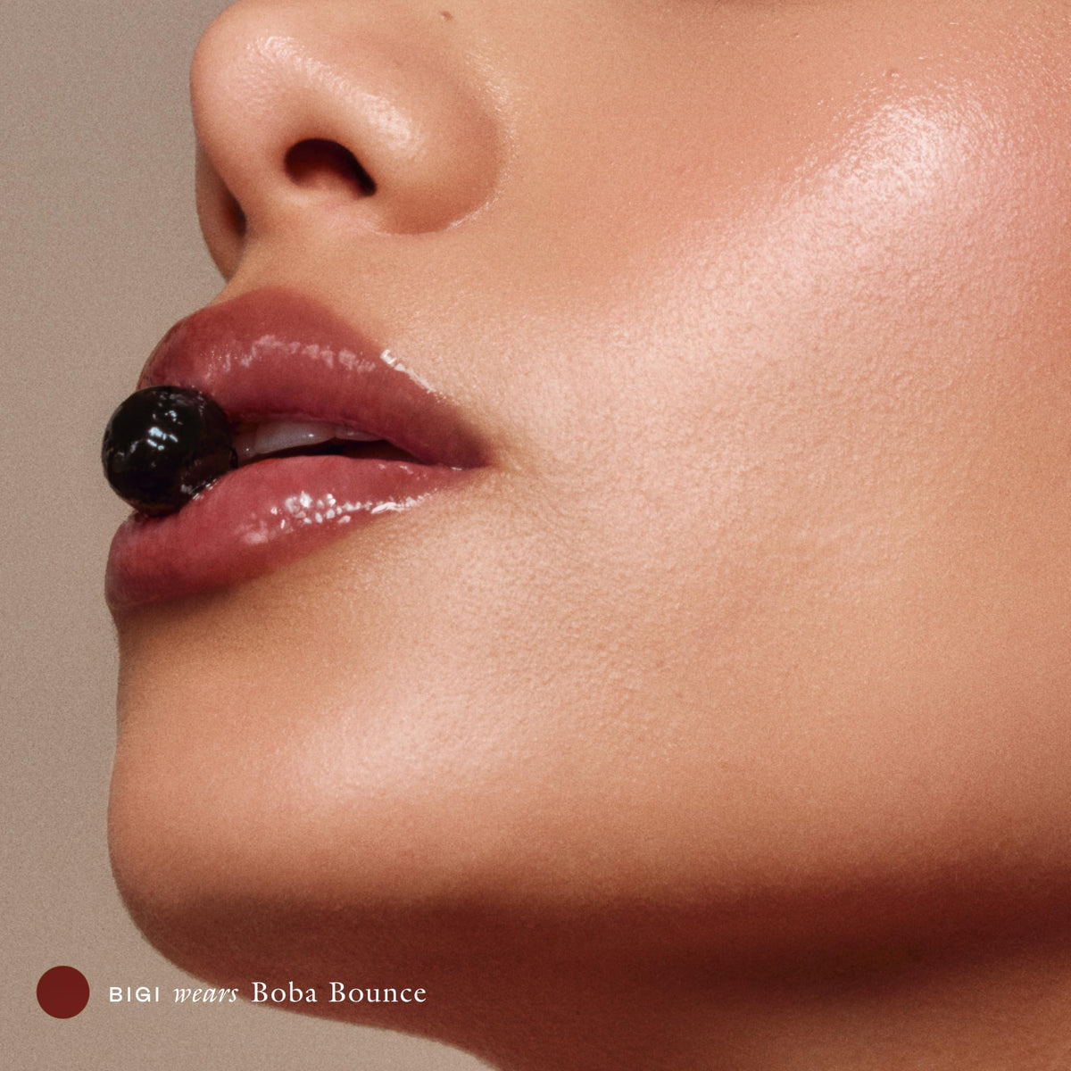 EADEM swatch on hand showing Boba Bounce gloss and instant smoothing effect