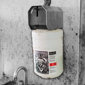 EAGLE GRIT dispenser in use on mechanic hands removing grease