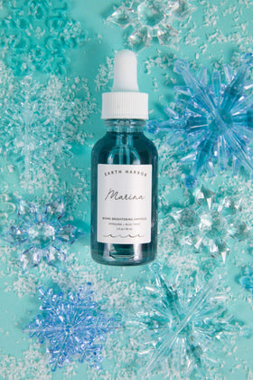 Earth Harbor hands applying ampoule showing easy absorption