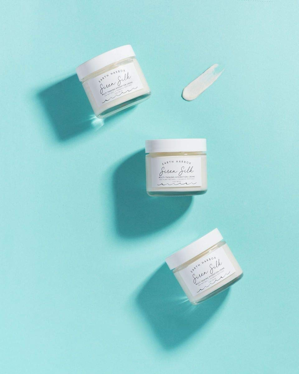 Earth Harbor opened jar revealing dewy cream for intense overnight moisture