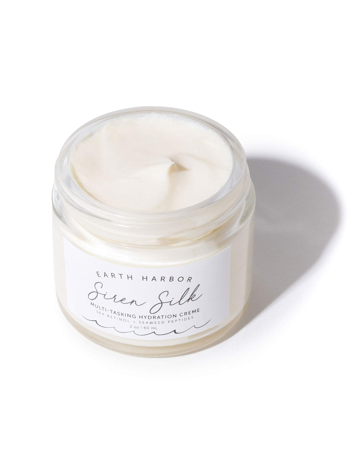 Earth Harbor cream texture close-up displaying whipped, absorbent formula
