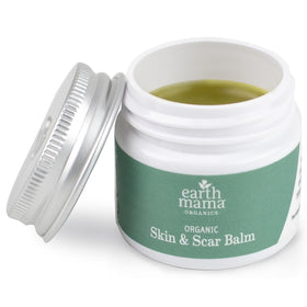 Earth Mama tins staged on bathroom shelf to show daily skincare use