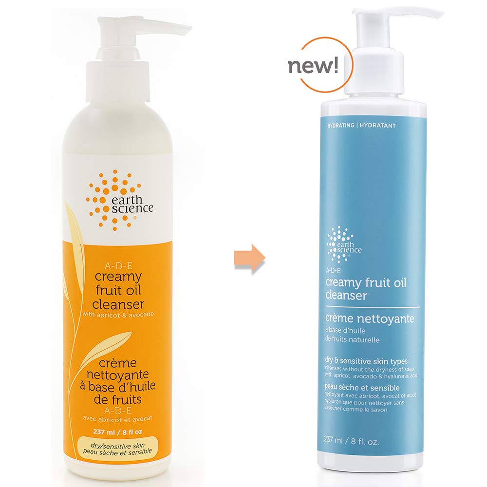 Earth Science ADE Creamy Cleanser texture closeup of milky lotion on fingertip, highlights gentle moisturizing feel