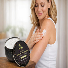 Earthly Body jar with jojoba and argan visuals indicating nourishing botanical oil benefits
