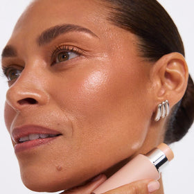 EarthsCure product on vanity at brunch, suggests effortless on-the-go glow and confidence