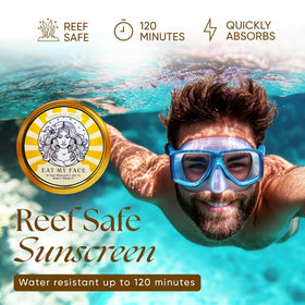 Eat My Face tin staged with beach essentials for outdoor, water-ready protection