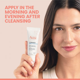 Eau Thermale Avène applying emulsion on face for matte finish
