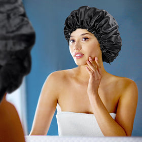 Edoneery model wearing bonnet in bed illustrating hair preserved overnight