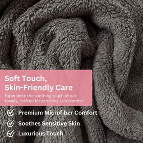 Efforest towel next to hand for scale, demonstrates generous coverage