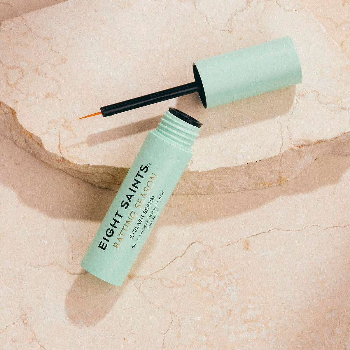 Eight Saints application demo applying serum along upper lash line