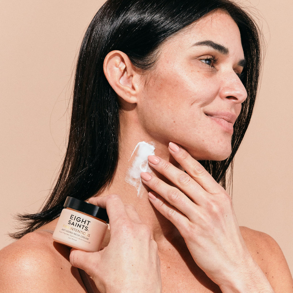 Eight Saints cream applied on neck demonstrating lifting motion and immediate hydration