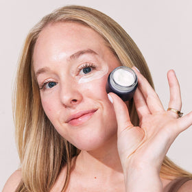 Eight Saints cream being applied to fingertip demonstrating easy application benefits