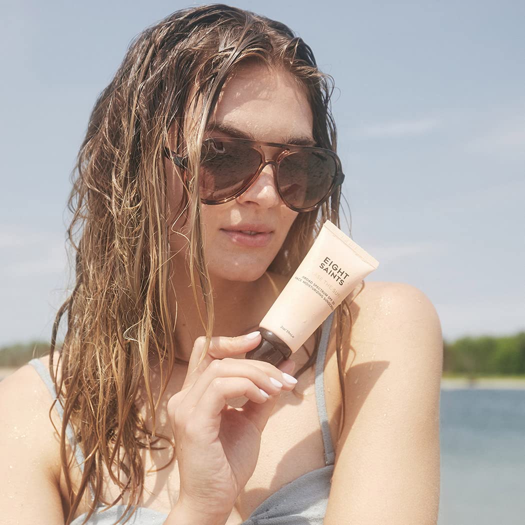 Eight Saints tube held in hand for scale, compact 2 ounce travel-friendly sunscreen