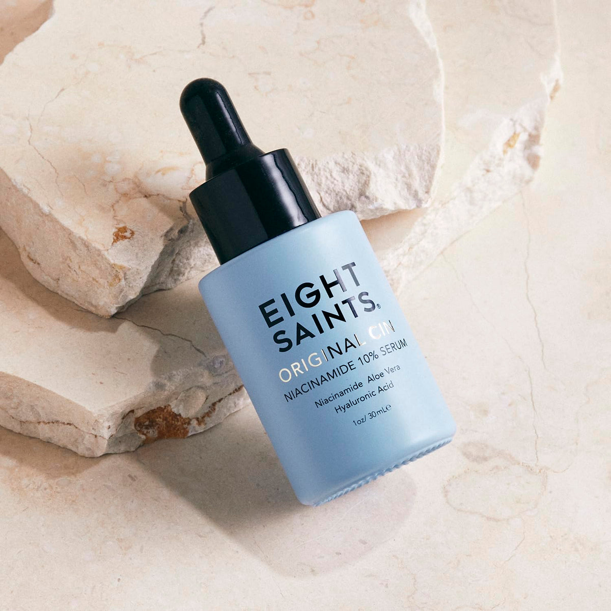 Eight Saints serum pipette dispensing gel texture, demonstrates smooth hydrating consistency