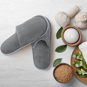 Elcoho slippers packed in a suitcase showing portability benefit