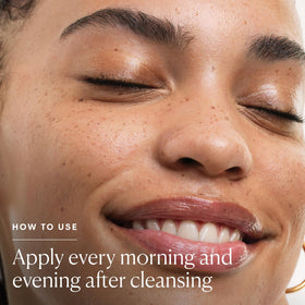 ELEMIS toner pouring action into cotton pad for easy application benefit