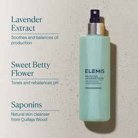 ELEMIS bottle next to hand for scale showing 6.7 fl oz size benefit
