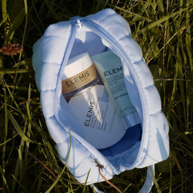 ELEMIS set on a travel bathroom shelf creating a polished on-the-road routine