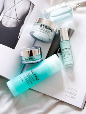 ELEMIS tube held in hand to show 150ml size and convenient portability