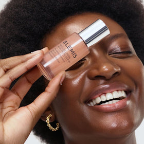 ELEMIS serum on fingertips showing lightweight texture and spreadability