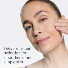 ELEMIS bottle held in hand to show 15ml size for travel-friendly use