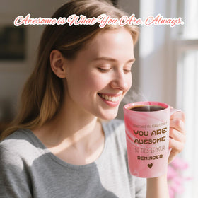 Eletorot pink marble mug with matching spoon highlighting comfortable grip