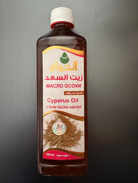 Elhawag oil being applied from bottle to hand for smooth skin benefit